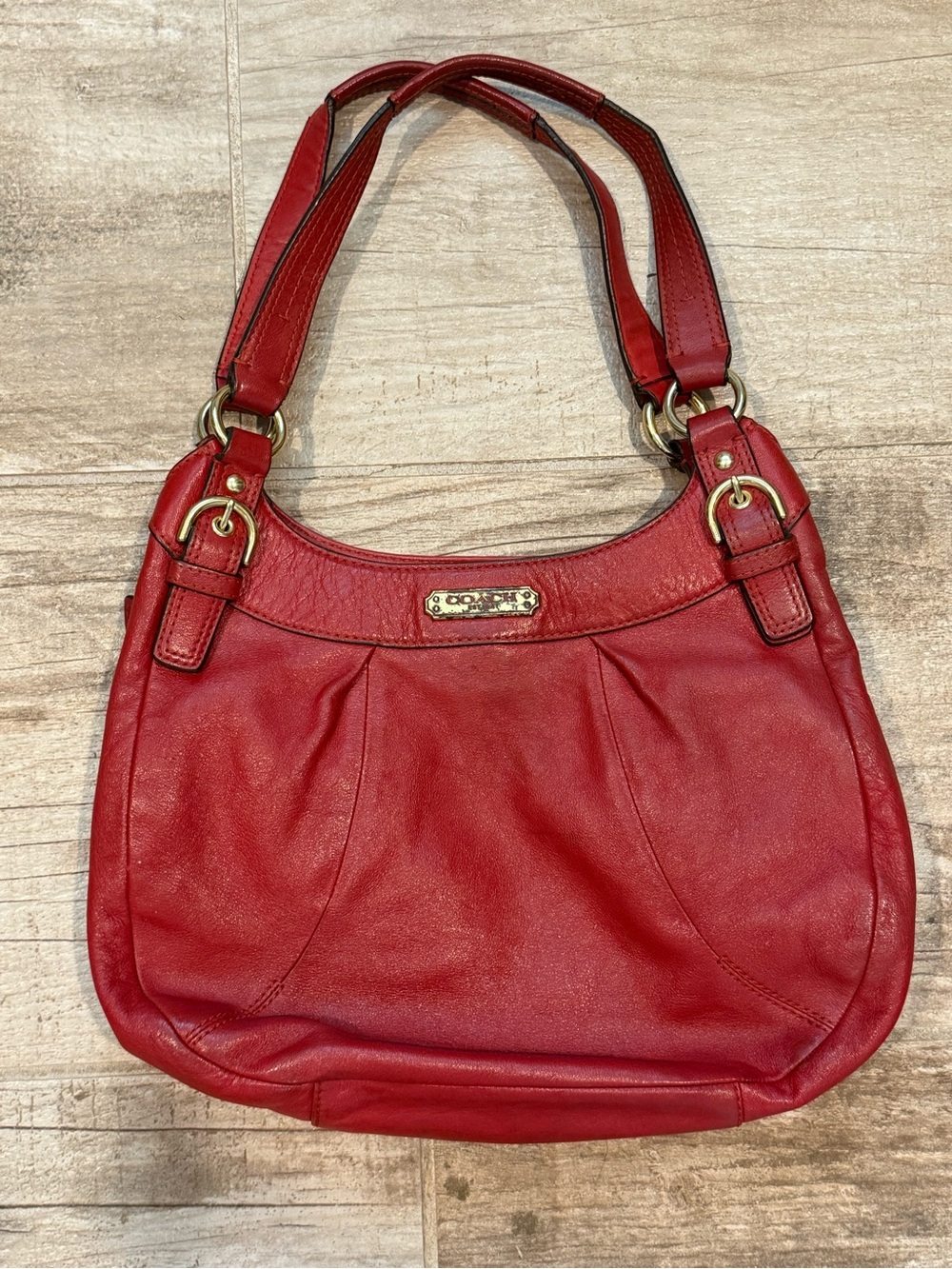 Vintage red leather Coach hobo shoulder bag with brass hardware